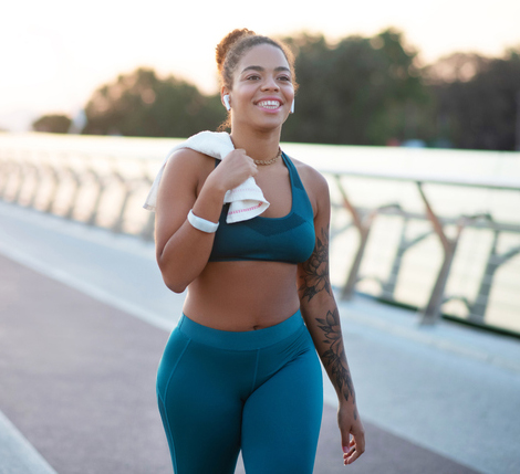 Tattooed young woman going home after running in the morning Semaglutide Weight Loss Program in Phoenix, AZ