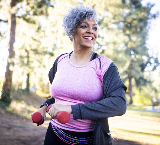 Senior Black Woman Stretching and Exercising with Weights Semaglutide Weight Loss Program in Phoenix, AZ