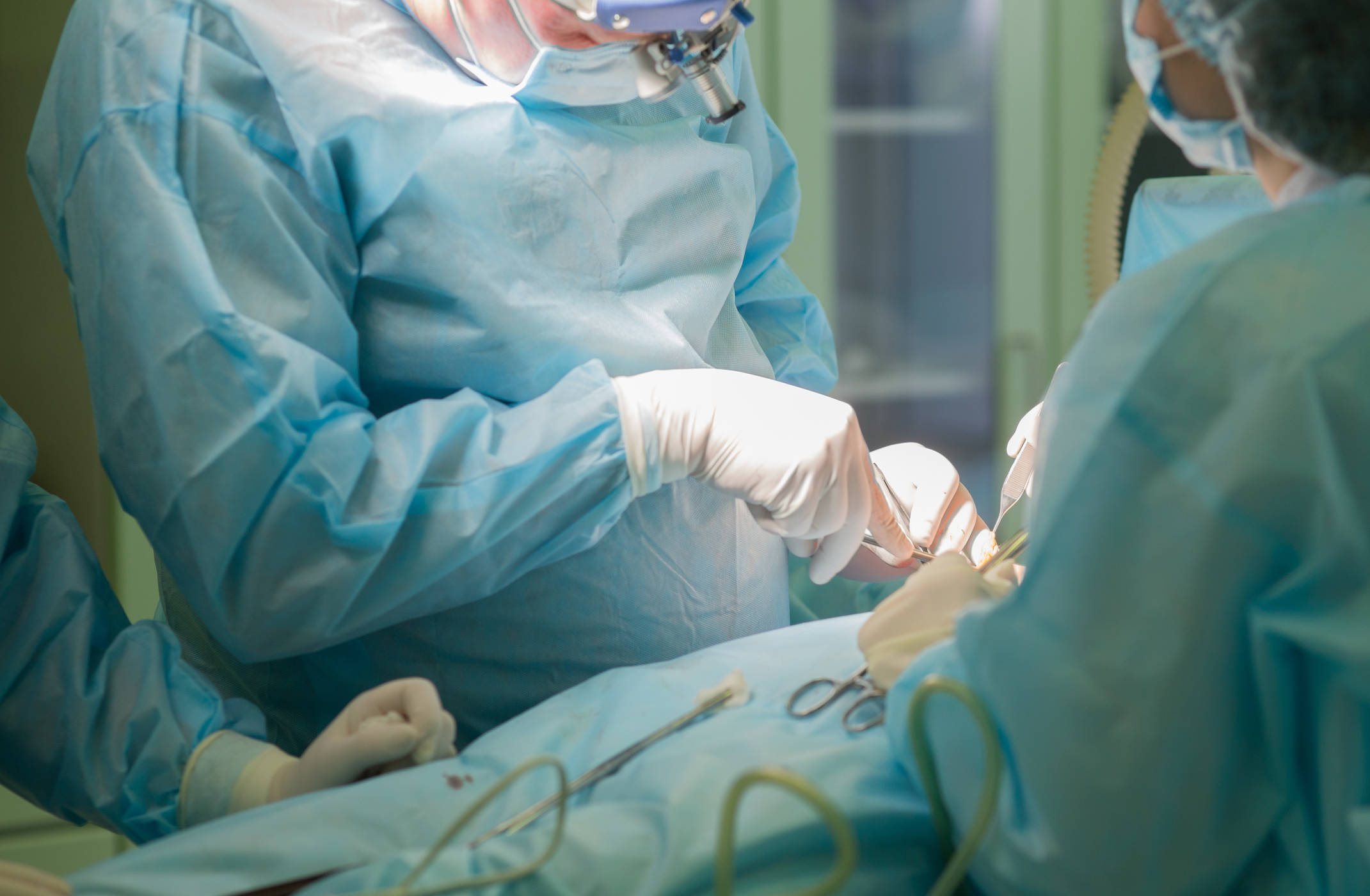 Surgeon at work. Surgery in hospital operating room Breast Augmentation in Phoenix, AZ